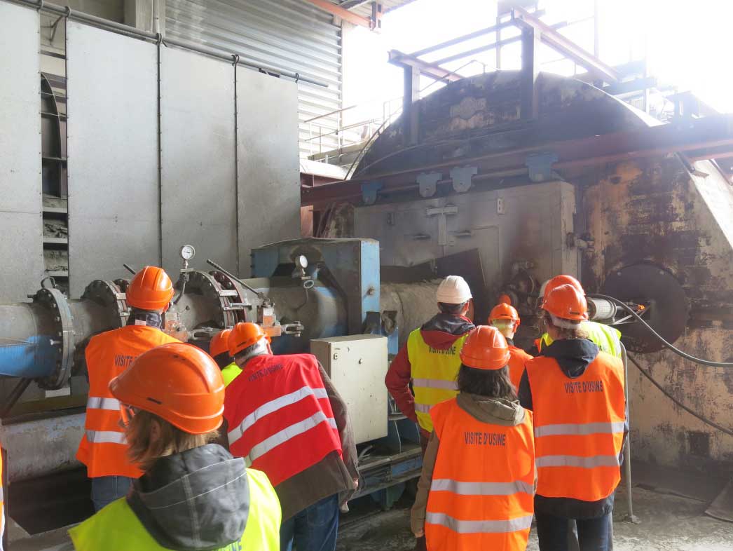 Alongside the burner at the hot end of the rotary kiln