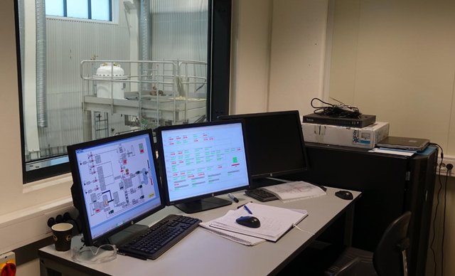 The-control-room-for-the-gasifier,-overlooking-the-reactor-in-the-background