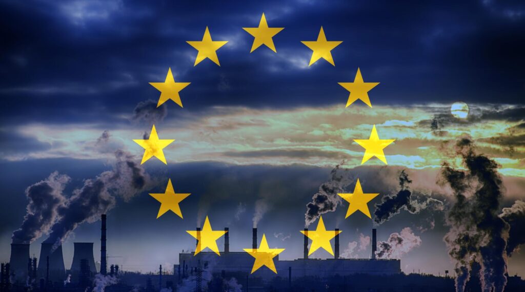 EU flag overlayed on a picture showing factories.