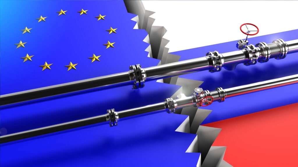 Pipes passing over flags of the EU and Russia, with a chasm in between.