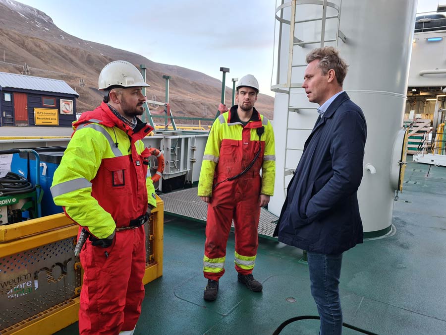Kronprins Haakon Captain Karl Robert Røttingen give a tour of the bridge to a group of people including Minister of Research and Higher Education Ola Borten Moe. 