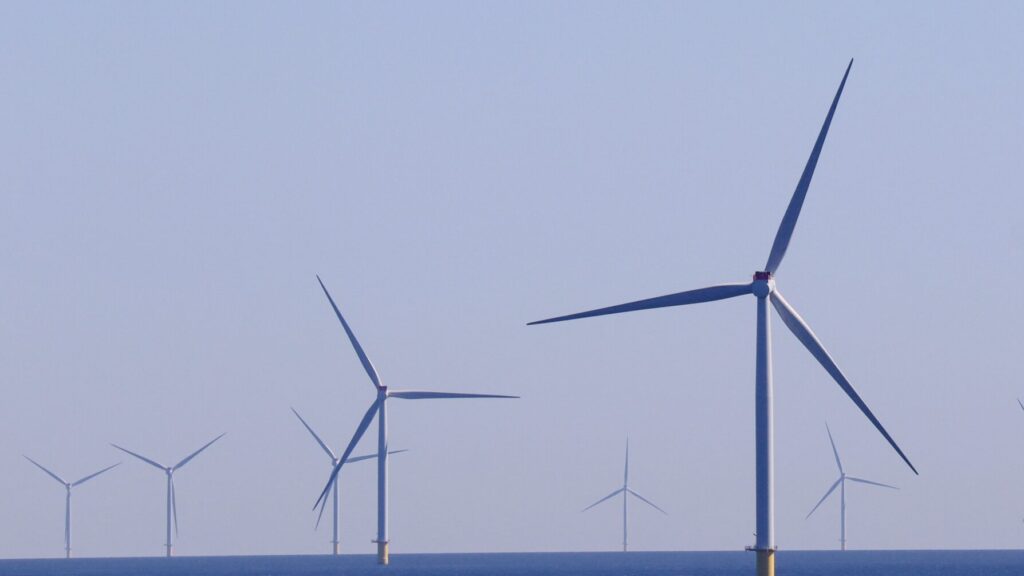 Photo by Damir.: https://www.pexels.com/photo/wind-turbines-on-the-sea-13223602/