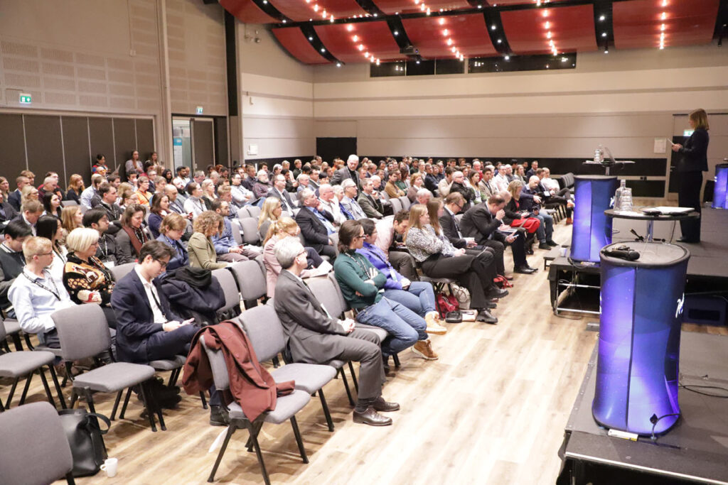 A large group of people attending a conference.