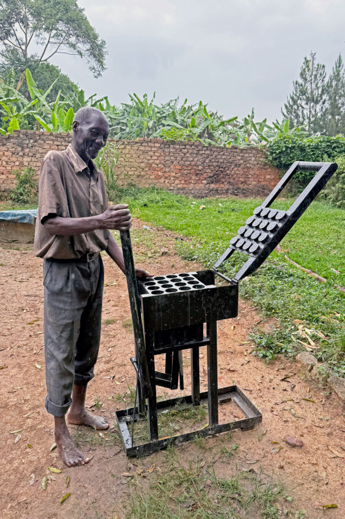 a man and his briquetting machine